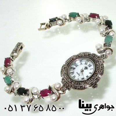 ساعت چند جواهر زمرد و یاقوت سرخ و کبود دایره ای زنانه