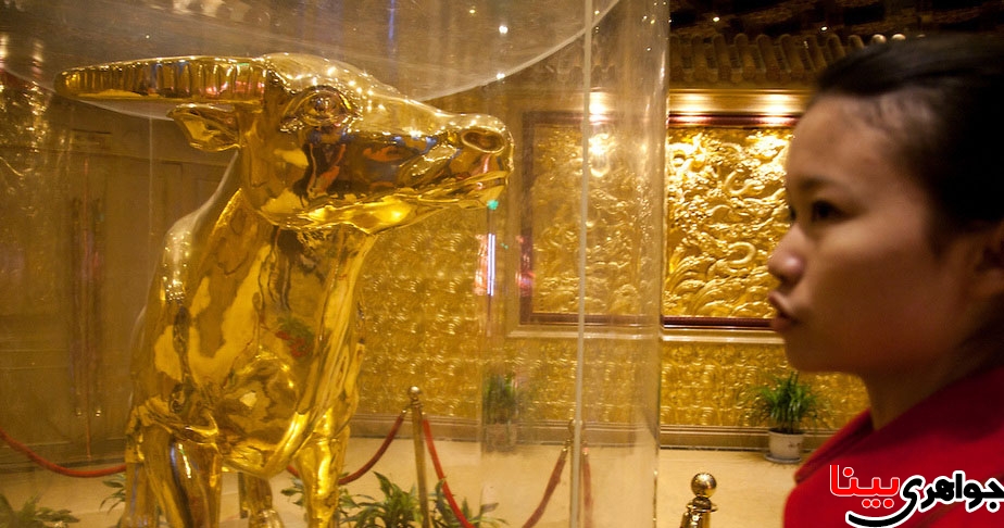 Gold adorns the interior of many floors and rooms of the towering skyscraper, There is even a gold bull which remains behind protective casing. Huaxi Village is known as the "No.1 village under the sky" and is apparently China's richest village. Huaxi, Jiangsu Province, China.